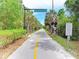 Scenic view of The Legacy Trail with palm trees and lush vegetation at 5709 Sunflower Cir, Sarasota, FL 34238