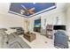 Relaxing living room with a custom ceiling, comfortable seating, and entertainment area at 5709 Sunflower Cir, Sarasota, FL 34238