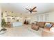 Open living space with a kitchen island, dining table, and leather seating area, perfect for entertaining guests at 5709 Sunflower Cir, Sarasota, FL 34238