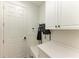 Mud room with a door to the outside, storage cabinets, and a bench at 5709 Sunflower Cir, Sarasota, FL 34238