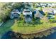 A scenic pond view enhances this home's screened-in pool and well-kept yard at 5709 Sunflower Cir, Sarasota, FL 34238