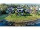 A scenic pond view enhances this home's screened-in pool and well-kept yard at 5709 Sunflower Cir, Sarasota, FL 34238