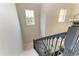 Carpeted stairs with views of the entrance and neighborhood at 5709 Sunflower Cir, Sarasota, FL 34238