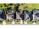 Aerial view of modern homes featuring screened-in pools,solar panels, and lush landscaping at 5746 Hydrangea Cir, Sarasota, FL 34238