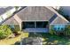 Aerial view of backyard featuring a well-maintained lawn, patio, and open space at 5746 Hydrangea Cir, Sarasota, FL 34238