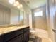 Traditional bathroom offering a granite vanity, shower/tub combination, and neutral color palette at 5746 Hydrangea Cir, Sarasota, FL 34238