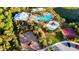 Stunning community pool area with a splash zone, playground, lounge area, and a basketball court near a pond at 5746 Hydrangea Cir, Sarasota, FL 34238