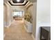 Elegant entryway featuring arched doorways and views into a bright, open-concept living space at 5746 Hydrangea Cir, Sarasota, FL 34238