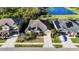 Charming single-story home features a well-manicured lawn and a welcoming front entrance near a beautiful lake at 5746 Hydrangea Cir, Sarasota, FL 34238