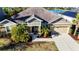 Attractive one-story home boasts verdant landscaping, palm trees and a 2 car garage at 5746 Hydrangea Cir, Sarasota, FL 34238