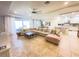 Open-concept living room and kitchen area boasting natural light and tile floors at 5746 Hydrangea Cir, Sarasota, FL 34238