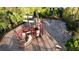 Aerial view of a playground with a pirate ship structure and other play equipment, nestled among trees at 5746 Hydrangea Cir, Sarasota, FL 34238