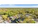 An elevated view showing waterfront community homes bordered by green space, offering a tranquil setting at 6201 Waverly Rd, Weeki Wachee, FL 34607