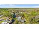 An aerial view of waterfront properties in a lush, green neighborhood with canal access at 6201 Waverly Rd, Weeki Wachee, FL 34607