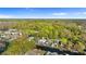 A serene aerial view of homes along a waterway, surrounded by verdant trees, with a property pin at 6201 Waverly Rd, Weeki Wachee, FL 34607