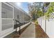 Inviting screened-in back porch, ideal for relaxing and enjoying the outdoors at 6201 Waverly Rd, Weeki Wachee, FL 34607