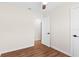 Bedroom features wood-look flooring, fresh neutral paint, and a ceiling fan at 6201 Waverly Rd, Weeki Wachee, FL 34607