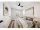 Cozy bedroom with hardwood floors, neutral decor, and a comfortable queen-sized bed at 6201 Waverly Rd, Weeki Wachee, FL 34607