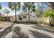 Charming home exterior with a fenced yard and driveway at 6201 Waverly Rd, Weeki Wachee, FL 34607