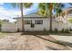 Exterior view of a cozy home featuring a fenced yard at 6201 Waverly Rd, Weeki Wachee, FL 34607