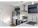 Modern kitchen boasting new stainless steel appliances and a large island with white countertops at 6201 Waverly Rd, Weeki Wachee, FL 34607