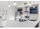 Updated kitchen featuring stainless appliances, quartz countertops and shaker style cabinets at 6201 Waverly Rd, Weeki Wachee, FL 34607