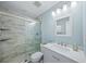 Modern bathroom features a glass shower, a stylish vanity, and updated fixtures at 691 Gulf Bay Rd, Longboat Key, FL 34228