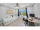 Well-lit bedroom featuring a daybed, desk, and a window, ideal for a study or guest room at 691 Gulf Bay Rd, Longboat Key, FL 34228