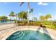 Outdoor hot tub with clear water and a surrounding brick patio at 7717 Mainsail Ln, Sarasota, FL 34240