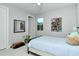 Cozy bedroom with neutral tones, white tile floors and a single bed at 7744 Sandhill Lake Dr, Sarasota, FL 34241