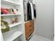 Organized closet with shelves, drawers and hanging storage; decorated with toys and clothing at 7744 Sandhill Lake Dr, Sarasota, FL 34241