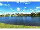Expansive lake view showcases the natural beauty, providing a peaceful backdrop for the surrounding residences at 7744 Sandhill Lake Dr, Sarasota, FL 34241