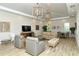 Bright and airy living room with modern lighting, comfortable seating, and stylish decor at 7744 Sandhill Lake Dr, Sarasota, FL 34241