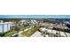 Wide aerial view of neighborhood, showcasing landscaping and surroundings at 800 N Tamiami Trl # 1506, Sarasota, FL 34236