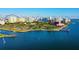 Panoramic aerial shot of a waterfront condominium complex, highlighting its prime coastal location and skyline views at 800 N Tamiami Trl # 1506, Sarasota, FL 34236