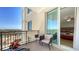 Balcony with outdoor seating and views, accessible from the bedroom at 800 N Tamiami Trl # 1506, Sarasota, FL 34236