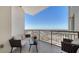 Relaxing outdoor balcony with seating area and stunning city views at 800 N Tamiami Trl # 1506, Sarasota, FL 34236