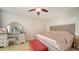 Bright bedroom features a vanity, bench, and tile flooring at 800 N Tamiami Trl # 1506, Sarasota, FL 34236