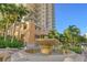 Beautiful exterior of the building featuring a fountain and tropical landscaping at 800 N Tamiami Trl # 1506, Sarasota, FL 34236