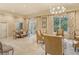 Relaxing common room with comfortable seating, a table, and natural light from windows at 800 N Tamiami Trl # 1506, Sarasota, FL 34236