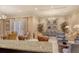Inviting common room with seating areas, plants, and artwork, perfect for social gatherings at 800 N Tamiami Trl # 1506, Sarasota, FL 34236
