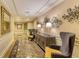 Elegantly decorated hallway with marble floors and decorative wall art at 800 N Tamiami Trl # 1506, Sarasota, FL 34236