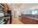 Open kitchen featuring granite counters and stainless steel appliances at 800 N Tamiami Trl # 1506, Sarasota, FL 34236