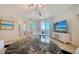 Bright living room featuring stylish decor, a view, and balcony access at 800 N Tamiami Trl # 1506, Sarasota, FL 34236