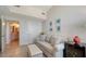 Inviting living room featuring a neutral color palette, with a sofa, ottoman, and a wine fridge at 800 N Tamiami Trl # 1506, Sarasota, FL 34236