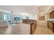 Open concept living space with tile floors, kitchen access, and bright natural light at 800 N Tamiami Trl # 1506, Sarasota, FL 34236