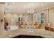 Elegant community lobby with stylish seating and access to a dining area at 800 N Tamiami Trl # 1506, Sarasota, FL 34236