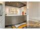 Welcoming lobby area with a modern reception desk, artistic decor, and elegant marble accents at 800 N Tamiami Trl # 1506, Sarasota, FL 34236