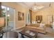 Inviting lounge area with a chandelier, comfortable seating, and natural light creates an elegant ambiance at 800 N Tamiami Trl # 1506, Sarasota, FL 34236