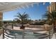 Inviting rooftop deck with a pergola, hot tub, and views of the city skyline and tropical landscaping at 800 N Tamiami Trl # 1506, Sarasota, FL 34236